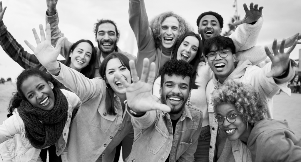 group of people smiling with their hands out, contact bird for any questions- we want to help.